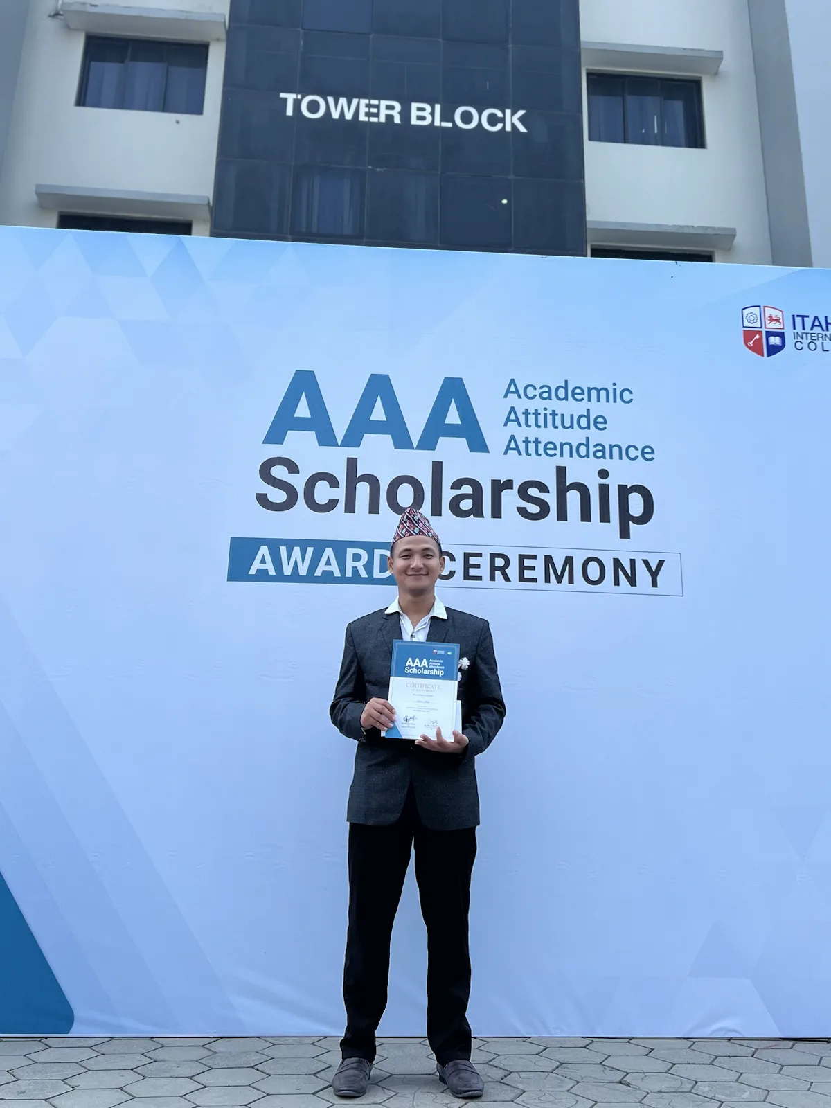 Kaman Limbu receiving the AAA Scholarship from Itahari International College